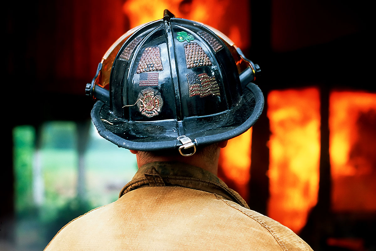 Firefighter overwhelmed with guilt and trauma after being unable to rescue people from an office building fire.